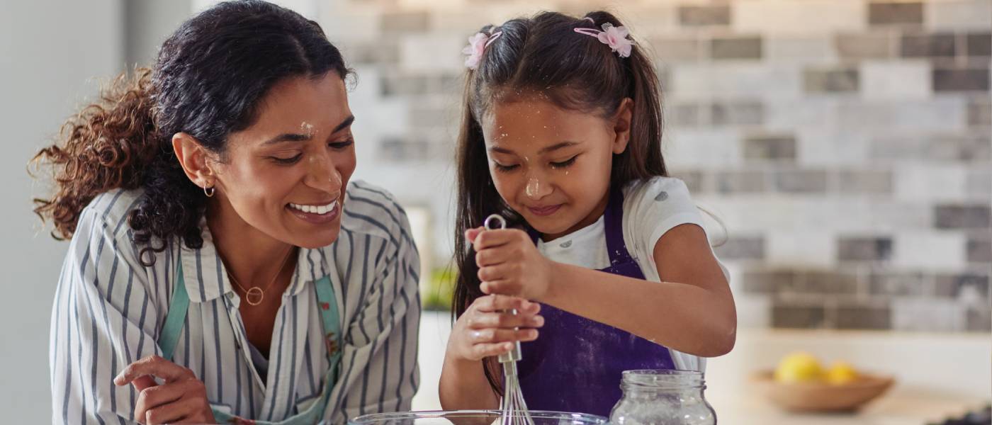 mom and daughter cooking