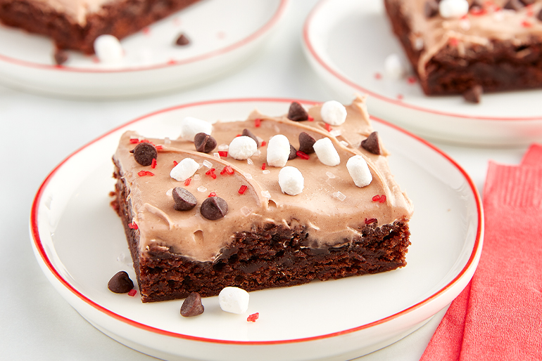 Brownies decorated with chocolate frosting and chocolate chips