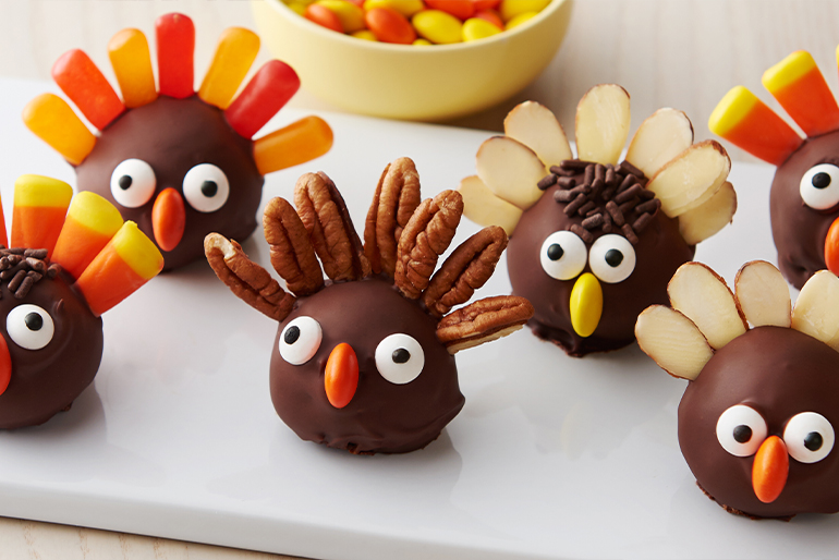 Cookie truffles covered with dark chocolate decorated as turkeys